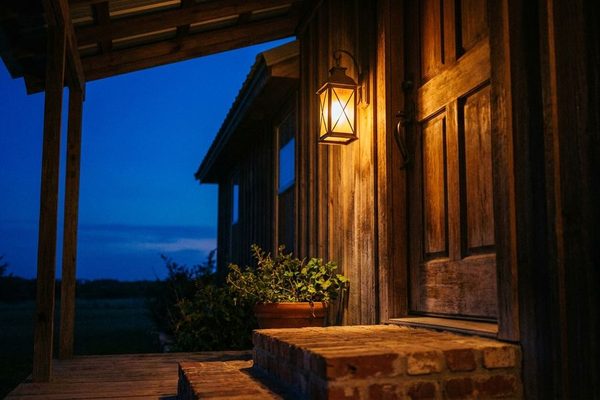 Porch light glowing at night, available 24 hours